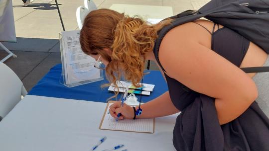 Student at Service Fair Booth