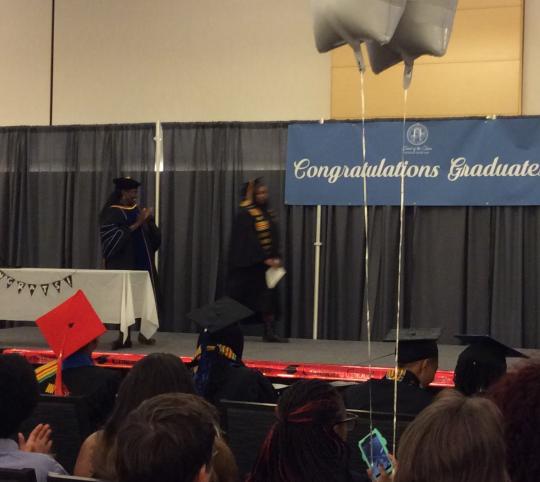 Graduates walking the stage