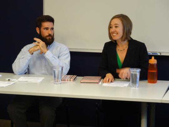 Panelists Sean and Angie answering questions on the rewards of service.