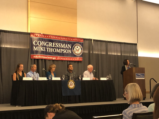 Judy Sakaki welcoming Congressman Mike Thompson and the panel to Sonoma State.