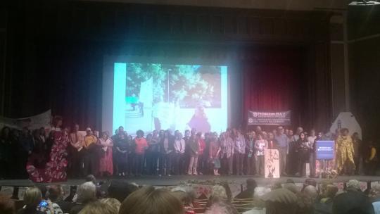 Audience members were asked to join speakers on stage by tenet and member for the Centro Laboral de Graton and Integrated Voter Engagement Team