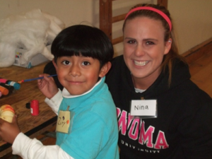 Nina Cragg, a volunteer from the CATS program and Zuriel Santiago, the sibling of a Sat Sidekicks participant.