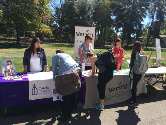 Students signing up for opportunities from Catholic Charities and Verity