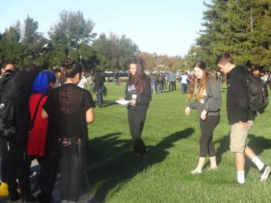 Understanding Media and SSU student, Hanna Green, leading a discussion with a group of local high school freshmen.